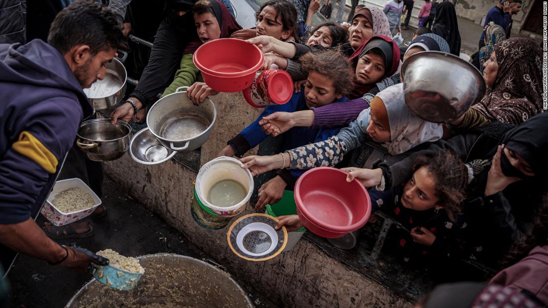 240112214658-food-distribution-gaza-refugee-camp-122823-super-tease.jpg