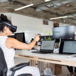 woman-in-white-tank-top-using-black-laptop-computer-with-vr-3861458-1-1024x683.jpg