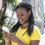 African-american-woman-texting-message-with-mobile-phone-000084696113_Full-scaled.jpg