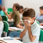 boy-blowing-nose-in-school.jpg