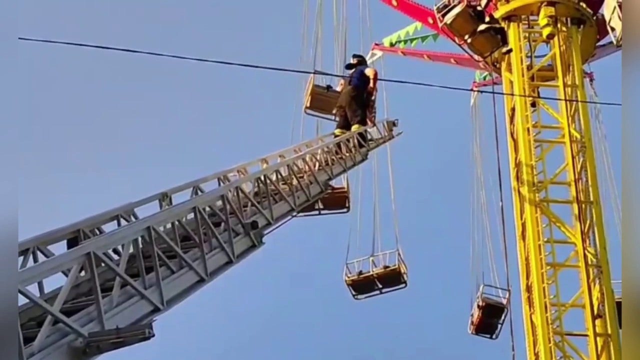 Emergency-personnel-rescue-13-people-stranded-on-amusement-park-ride.jpg