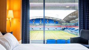 Bolton-Stadium-Hotel-a-member-of-Radisson-Individuals-Guest-room-Pitch-View.1-e1724416341633-300x169.jpeg