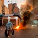 Burning-tyres-to-keep-away-military-and-burning-Maduro-posters-CREDIT-Catherine-Ellis-1722648381.jpe