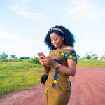 Women-using-smartphone-in-a-field-scaled.jpg