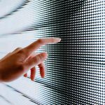 Close-up-of-womans-hand-touching-illuminated-LED-display-screen-connecting-to-the-future-1024x683.jp.jpeg