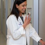 108150592-1748346884055-Clinician_entering_an_exam_room.jpg