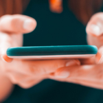 Person_holding_phone_600x300.png