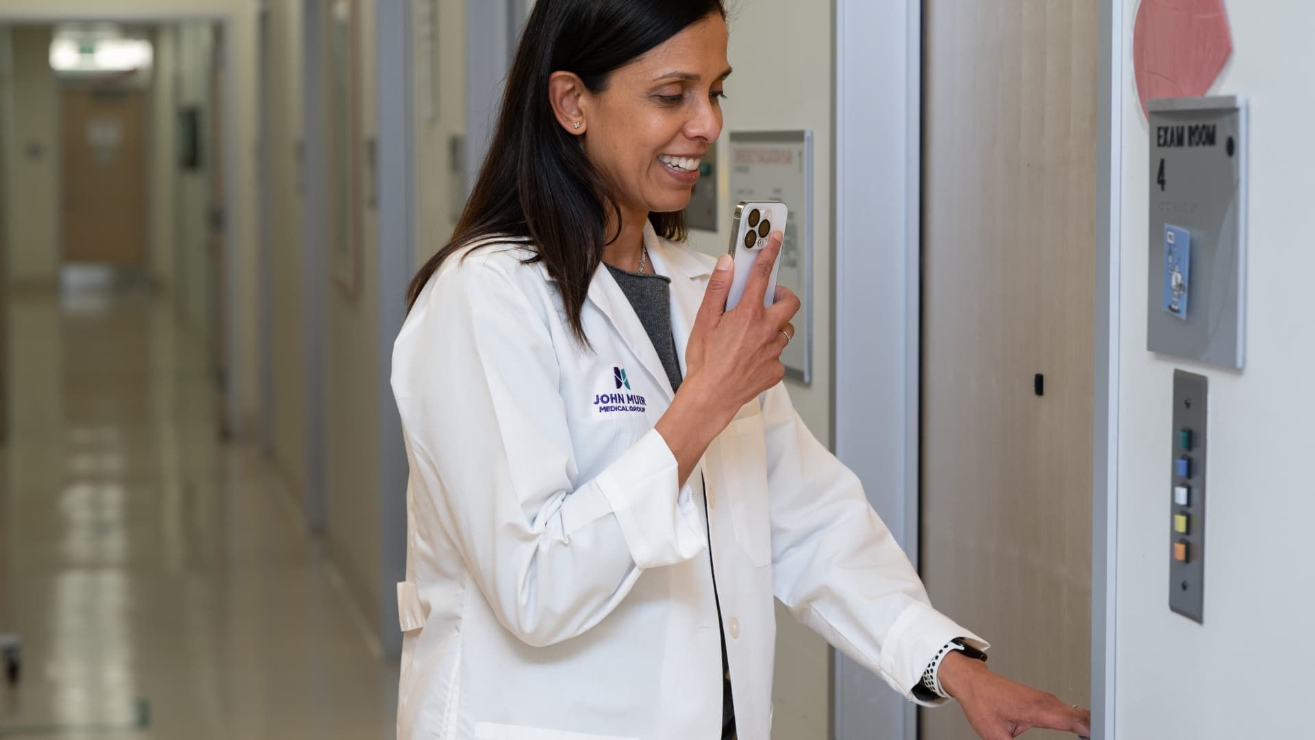 108150592-1748346884055-Clinician_entering_an_exam_room.jpg