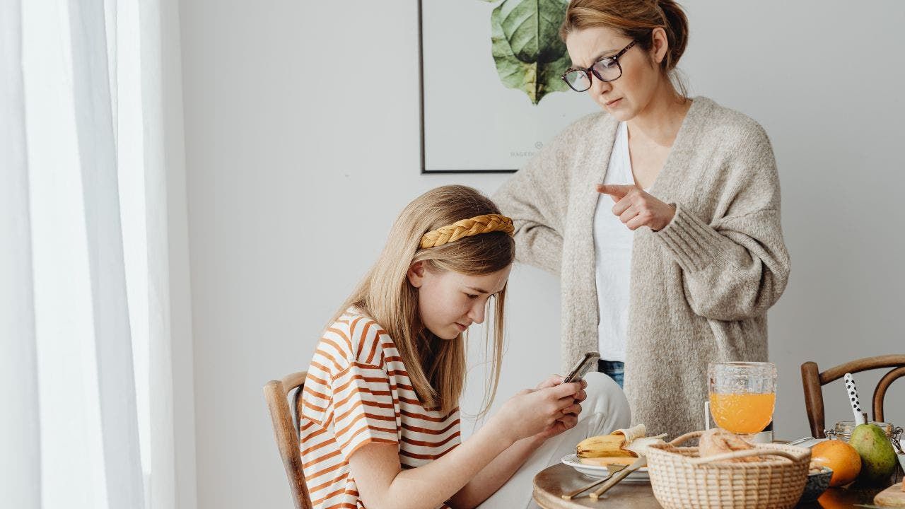 3-MOM-AND-KID-ON-PHONE.jpg