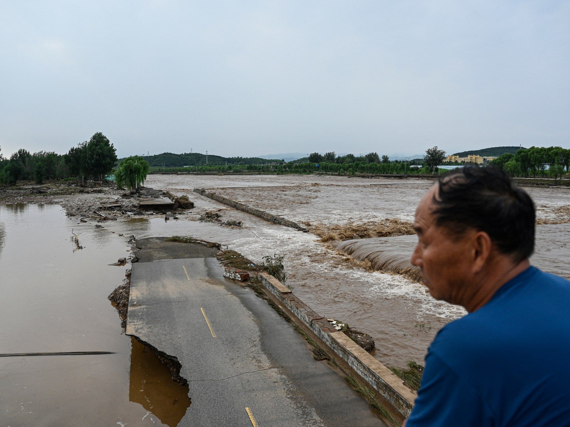AFP__20250728__682N2G4__v2__HighRes__TopshotChinaEnvironmentWeatherFloods-1753749424.jpg