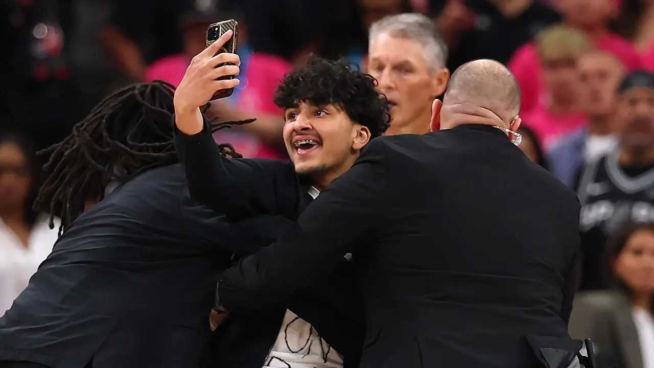 Security-detains-fan-NBA-Finals.jpeg