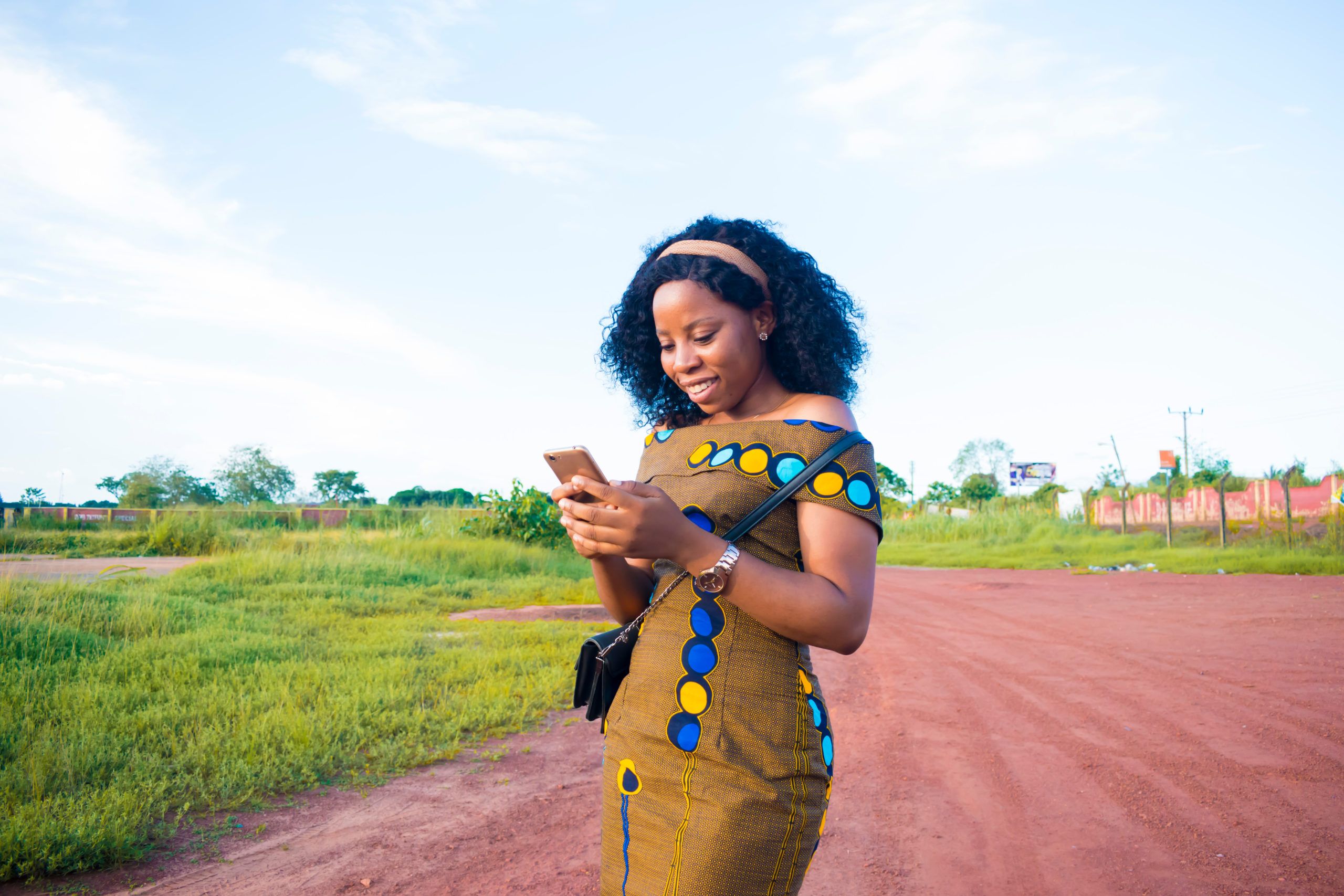 Women-using-smartphone-in-a-field-scaled.jpg