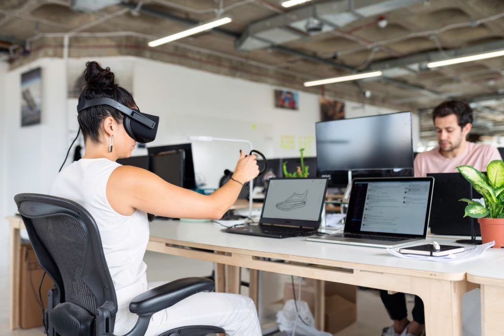 woman-in-white-tank-top-using-black-laptop-computer-with-vr-3861458-1-1024x683.jpg